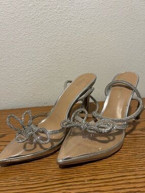 BCBGeneration Silver Pointed Toe Strappy Heels with Bow Accent